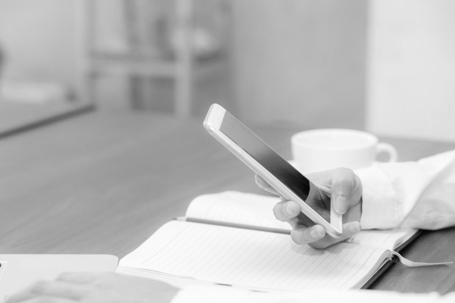 Financial modeling workspace with multiple monitors displaying spreadsheet analysis and market data