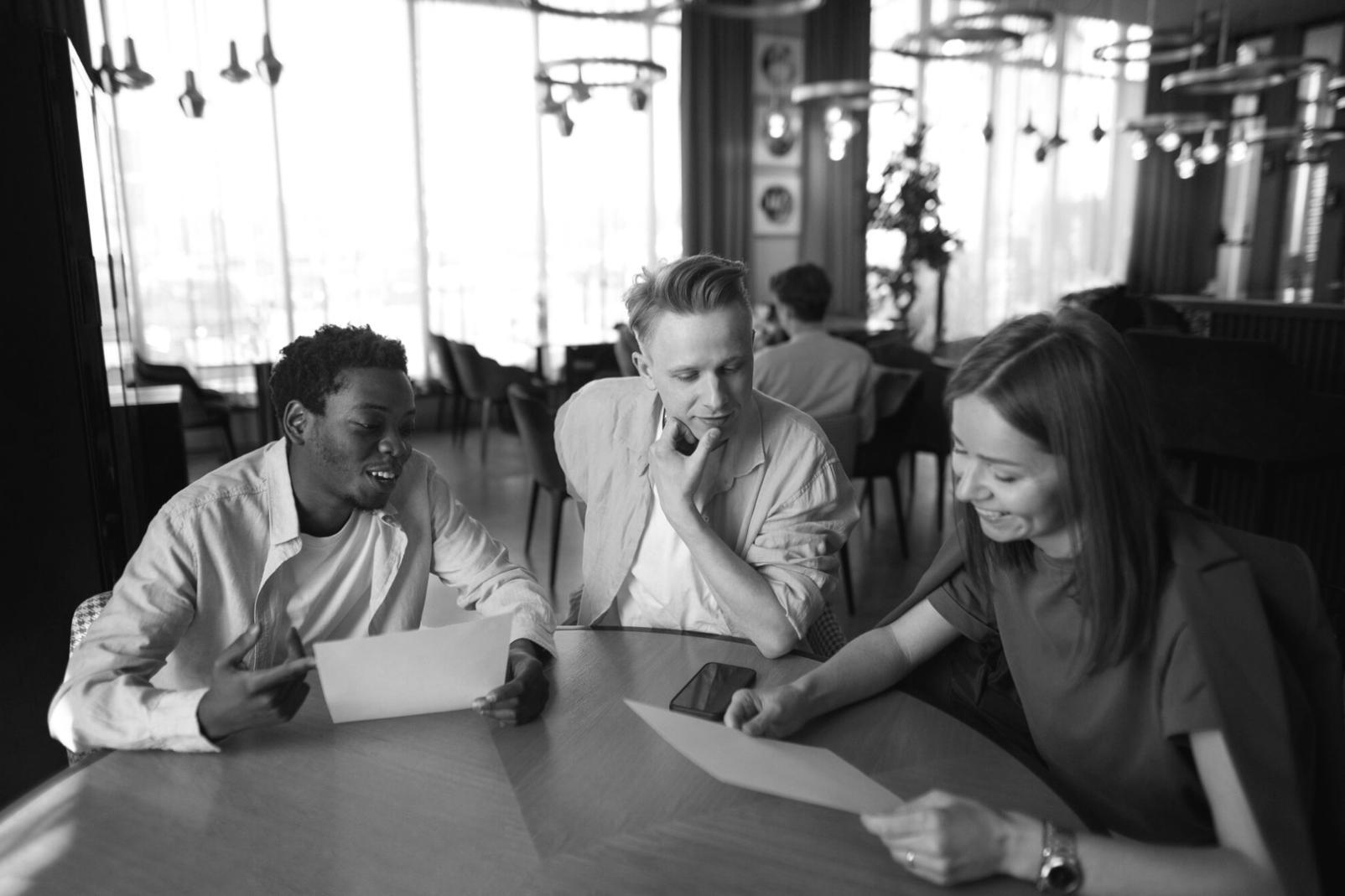 Student working through complex financial model on laptop with detailed spreadsheet formulas visible